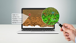 Laptop with terrain map and magnified data view for precise coverage prediction and interference analysis
