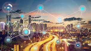 Spectrum Regulation and Frequency Management for Authorities City network with radio icons representing spectrum regulation and frequency management for authorities.