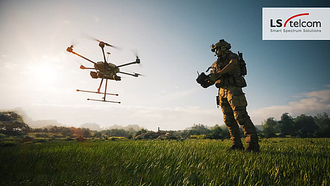 Soldier controls a drone in the field, illustrating spectrum operations for defense mission planning.